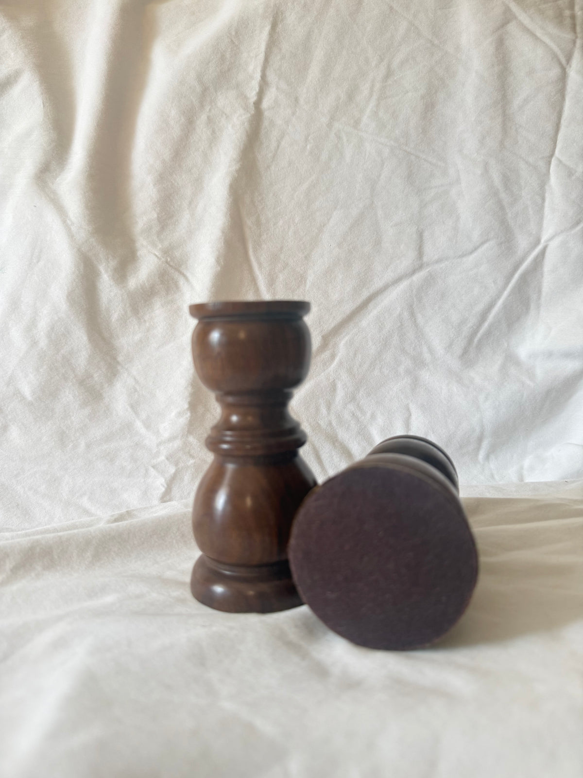 Felt base of turned wood candle holder