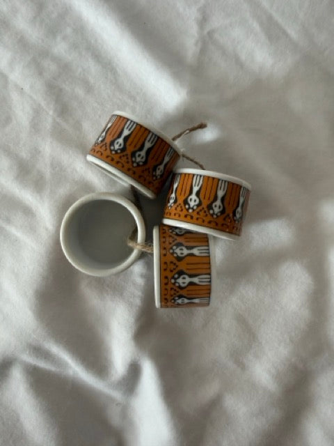 Four porcelain napkin rings from above