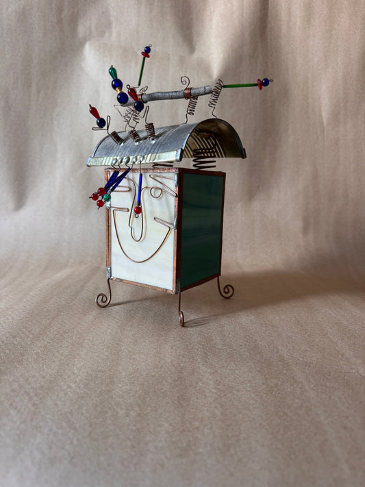 Beaded wire springs and twig on top of the lantern