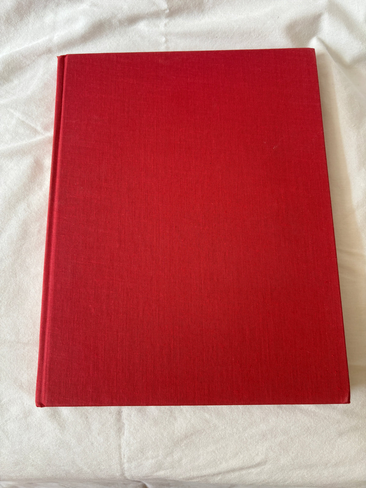 Red cloth cover of the Louvre volume
