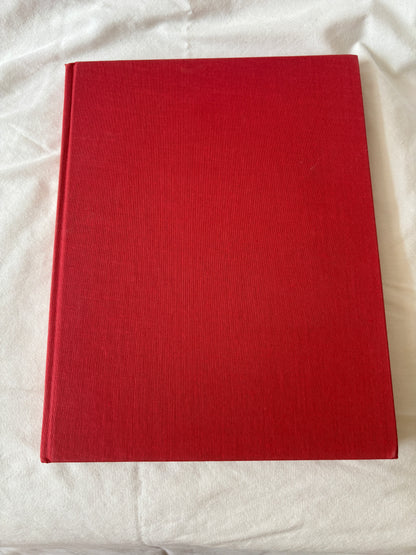 Red cloth cover of the Louvre volume