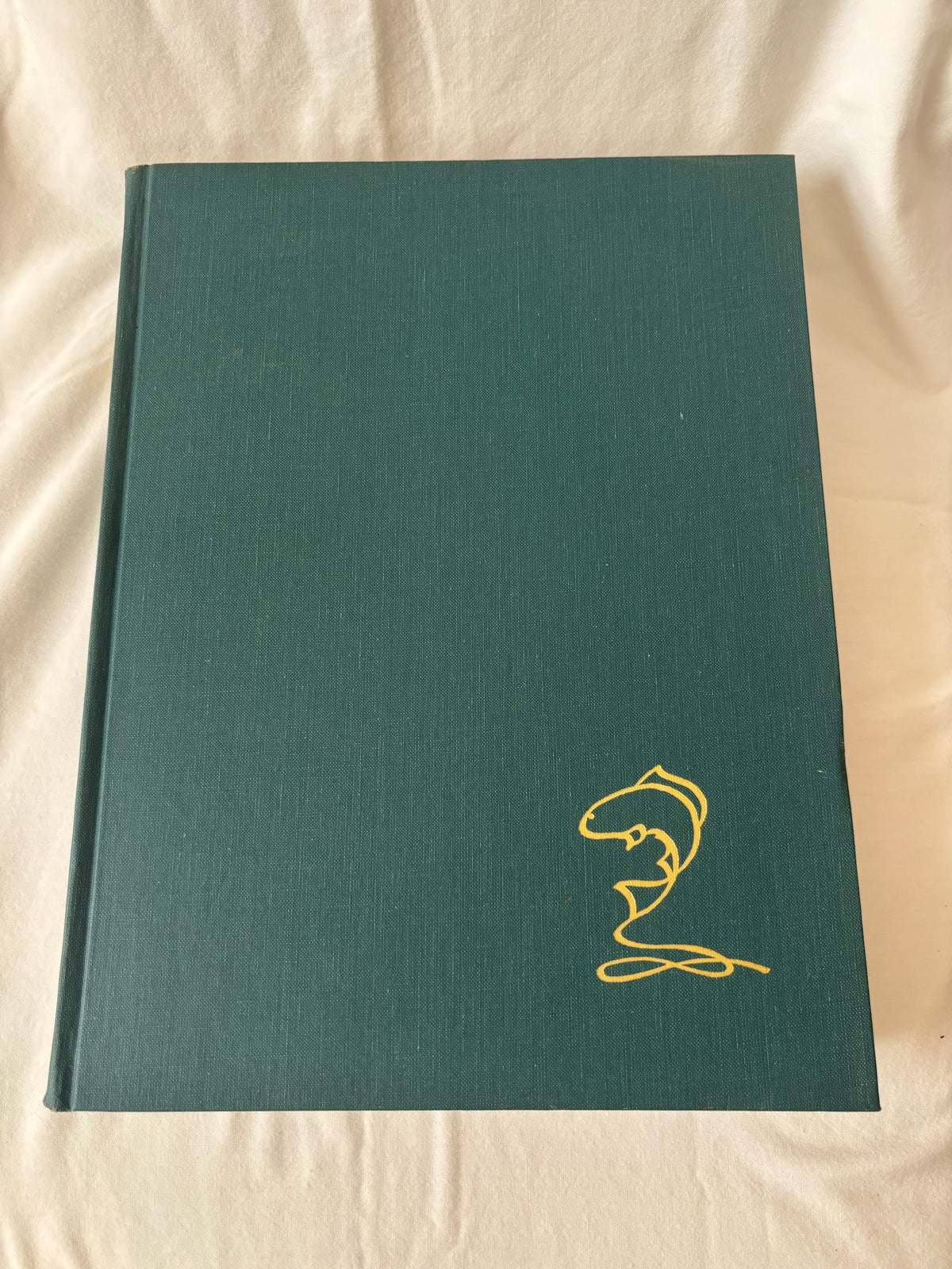 Green cloth front board with gilt fish