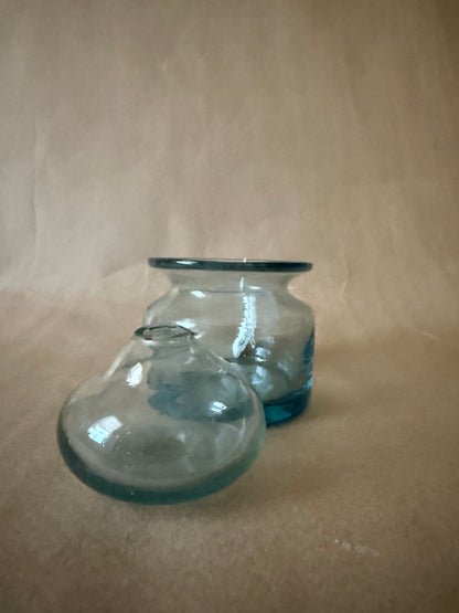 Aqua glass jar with lid removed and set beside it