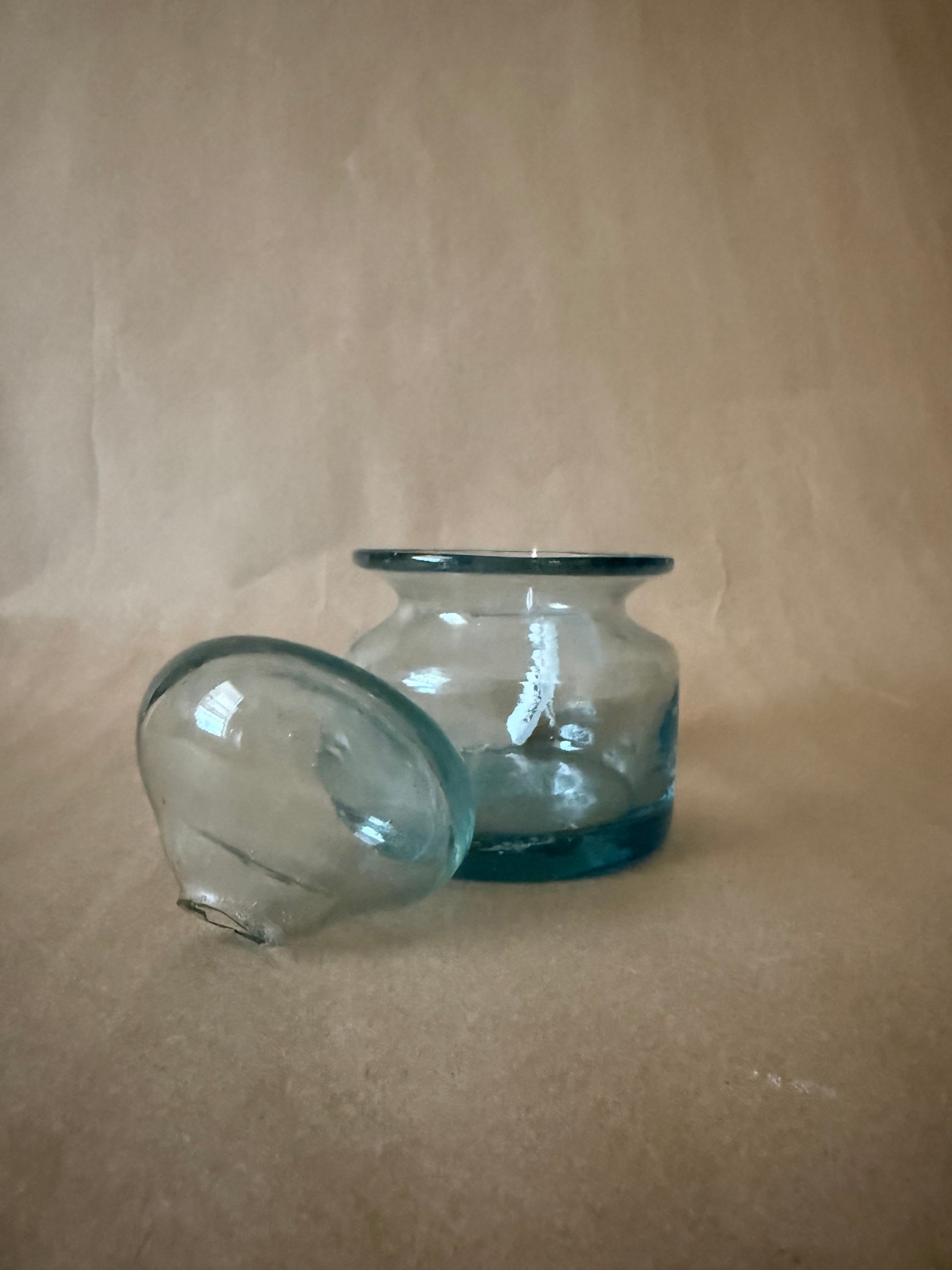 Aqua glass jar and lid, side view