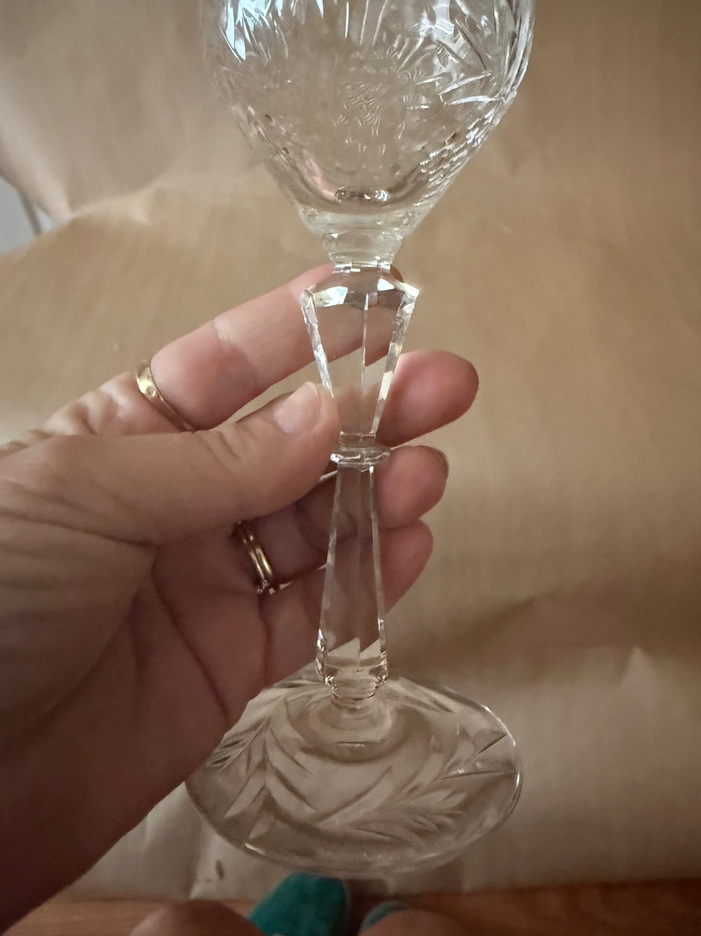 Detail of the faceted knop stem and starburst-cut foot