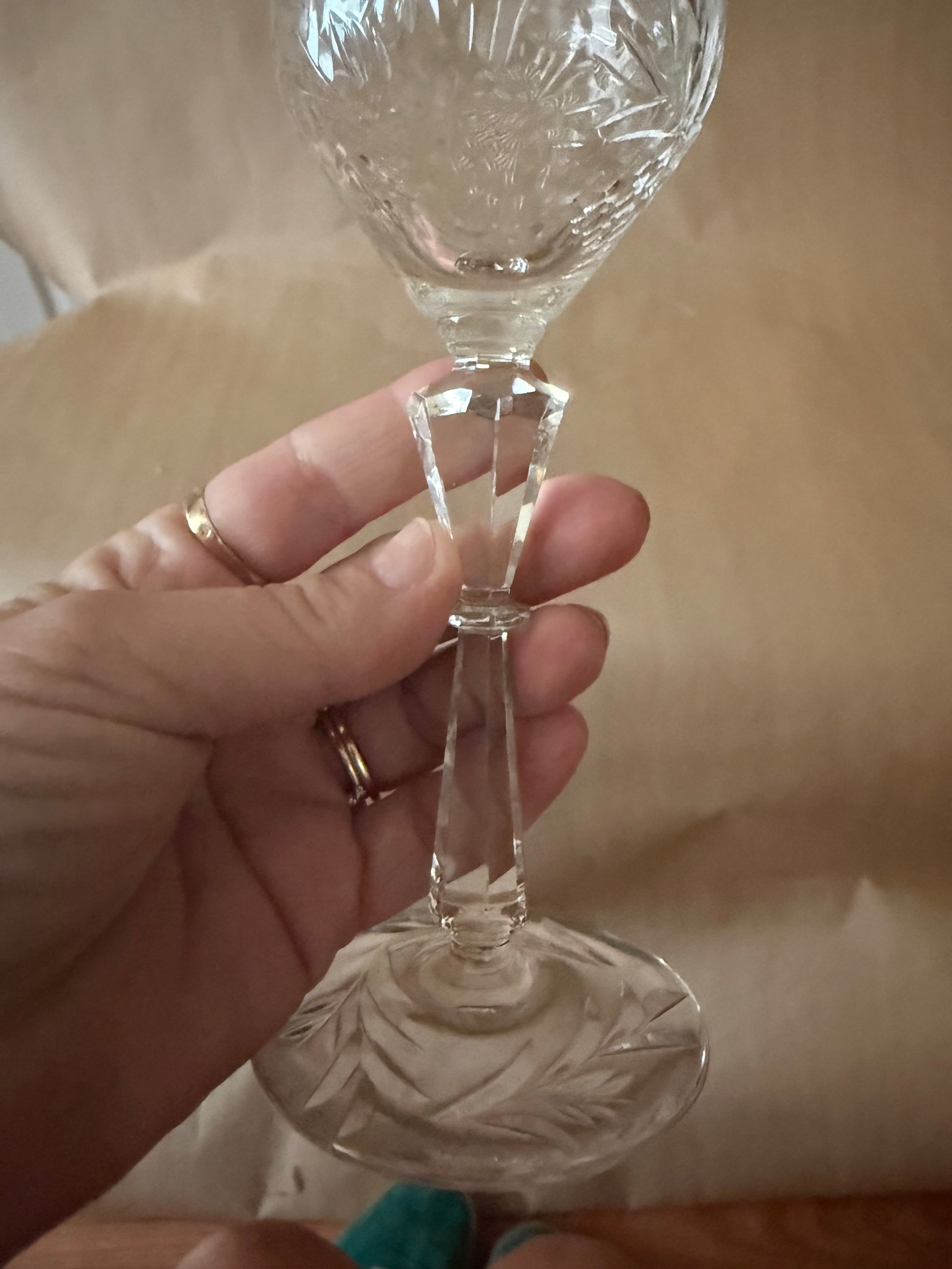 Detail of the faceted knop stem and starburst-cut foot