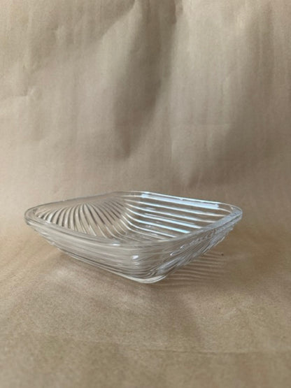 Square clear glass dish with a ribbed swirl pattern