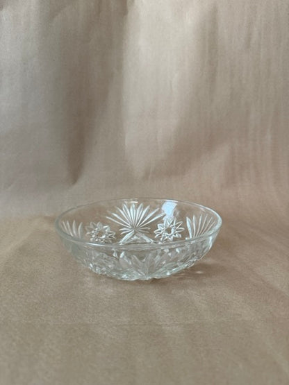 Round clear pressed glass bowl with fanned starburst pattern