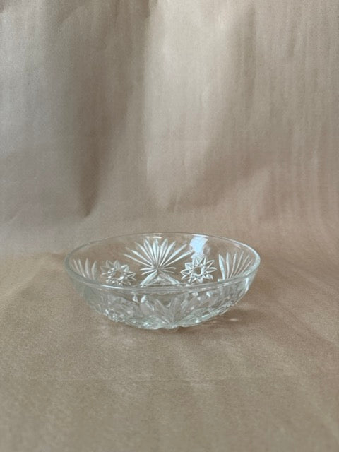Round clear pressed glass bowl with fanned starburst pattern
