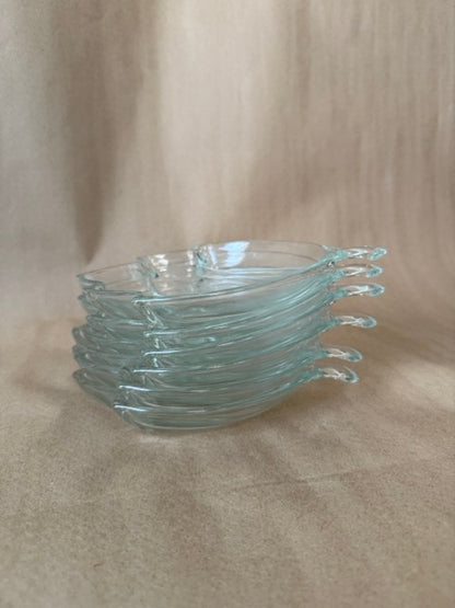Stack of six leaf-shaped clear glass divided dishes