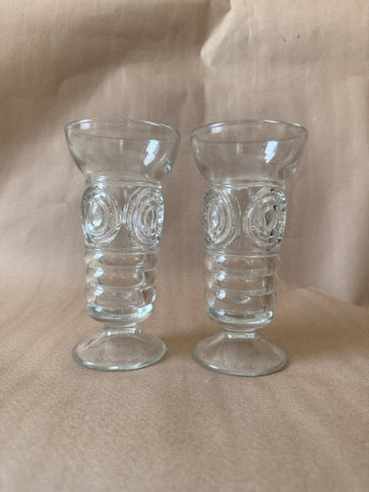 Pair of bullseye pressed glass footed vases, angled