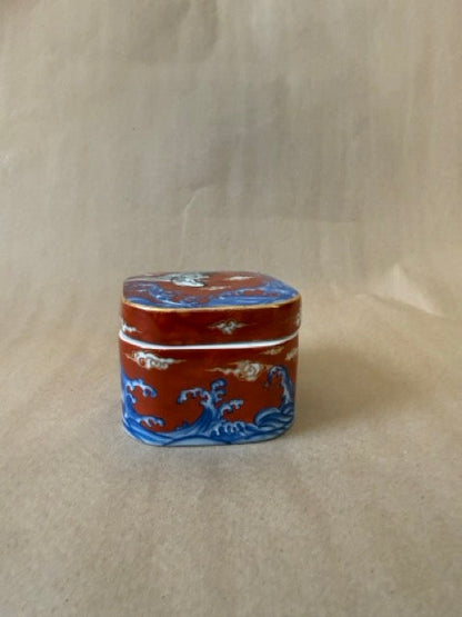 Japanese porcelain lidded box with crane and waves
