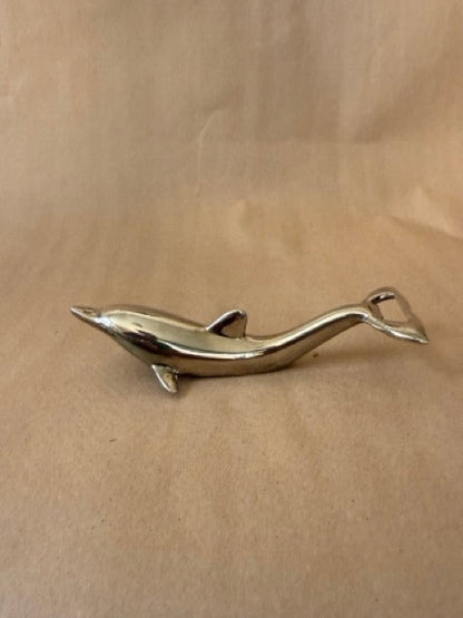 Dolphin opener, showing the opener in the tail