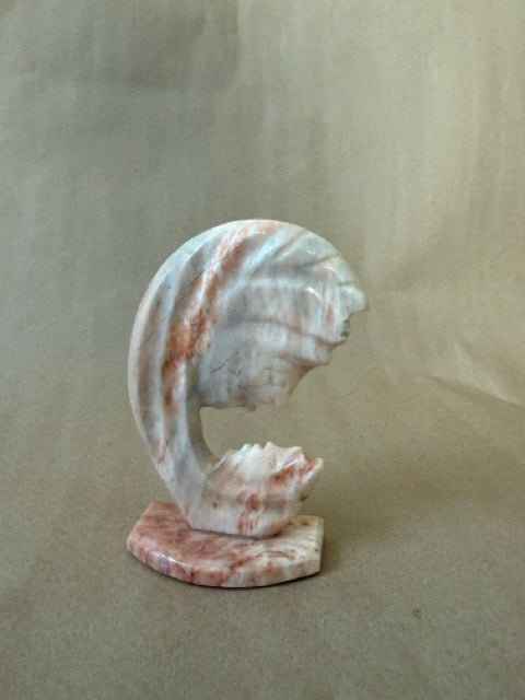 Carved marble wave sculpture