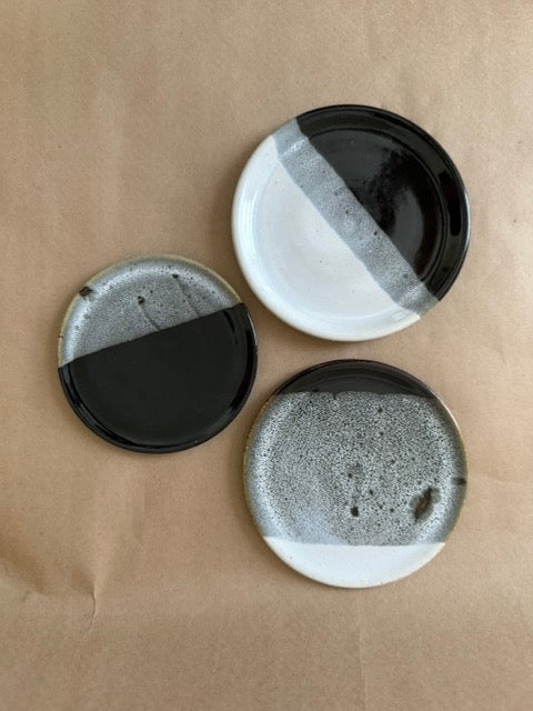 Studio pottery black and white plates, set of three