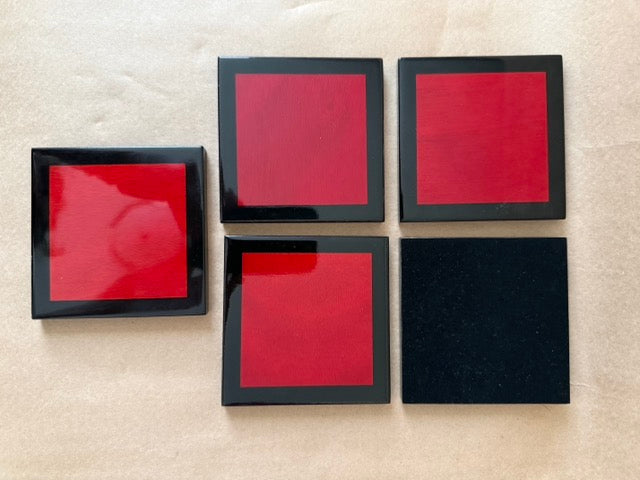 Black lacquer coasters with red centers