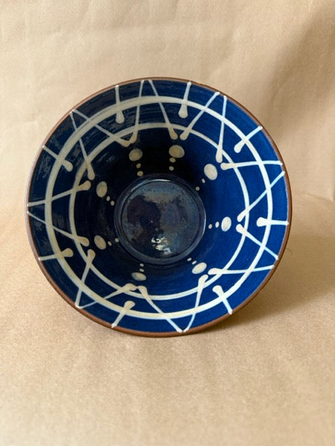 Bowl interior, white slip trailing on blue