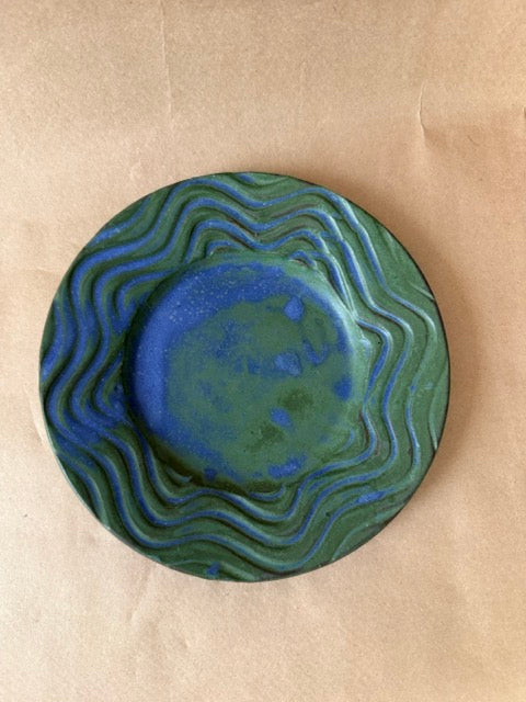 Signed studio pottery plate in green and blue
