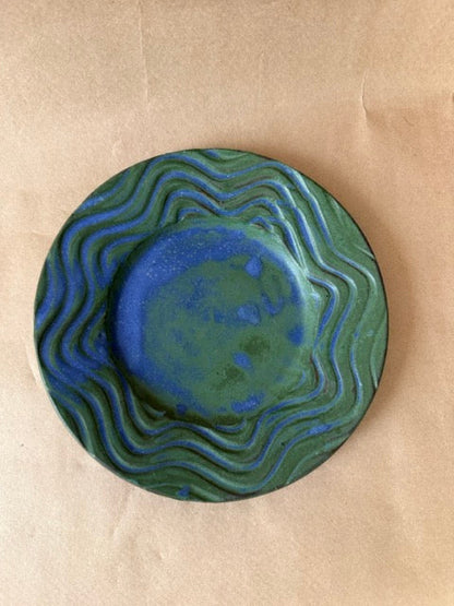 Signed studio pottery plate in green and blue