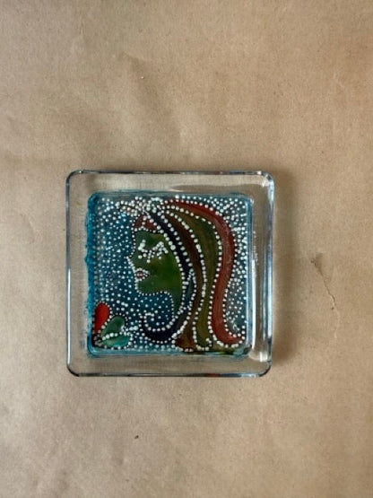 Reverse-painted glass dish with woman in profile