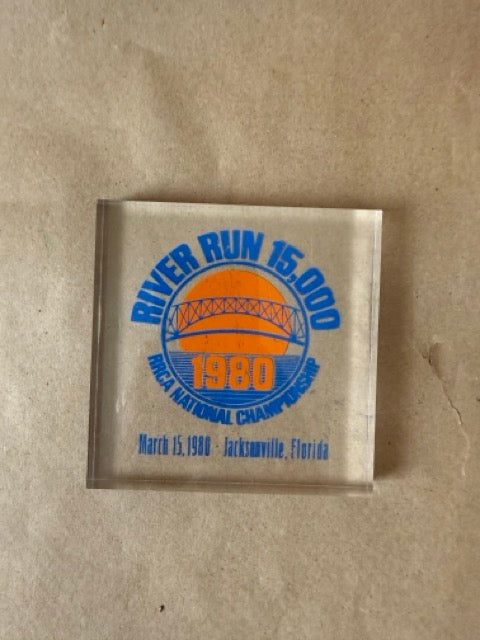 River Run 1980 lucite paperweight