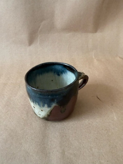 Drip mug, glaze breaking to cream