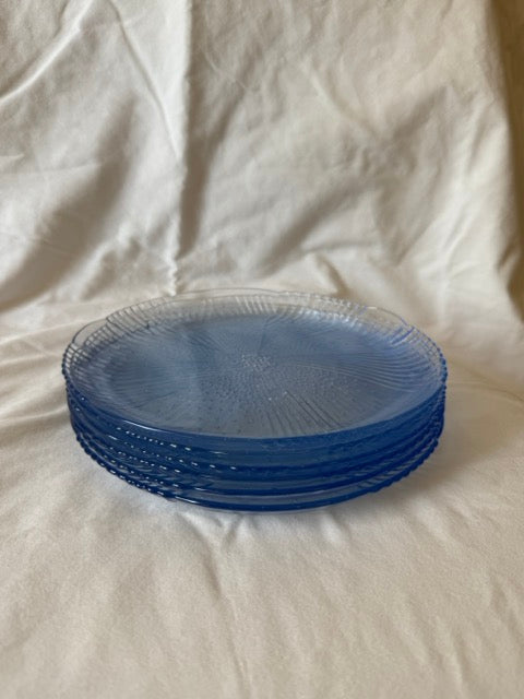 Stack of blue swirl glass luncheon plates