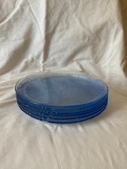 Stack of blue swirl glass luncheon plates
