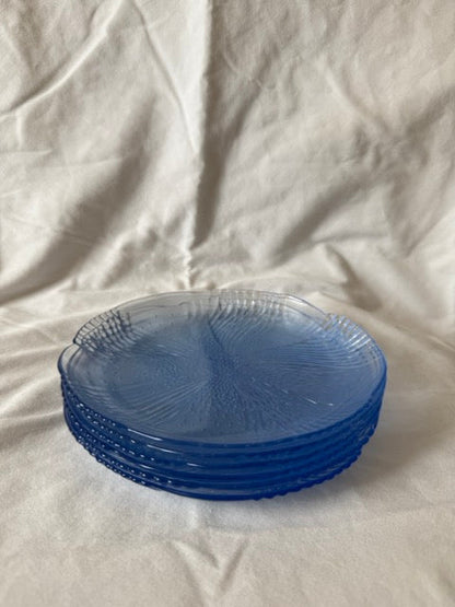 Stack of blue swirl glass salad plates