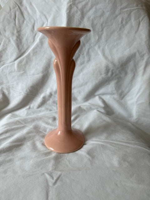 Peach candlestick showing fluted stem