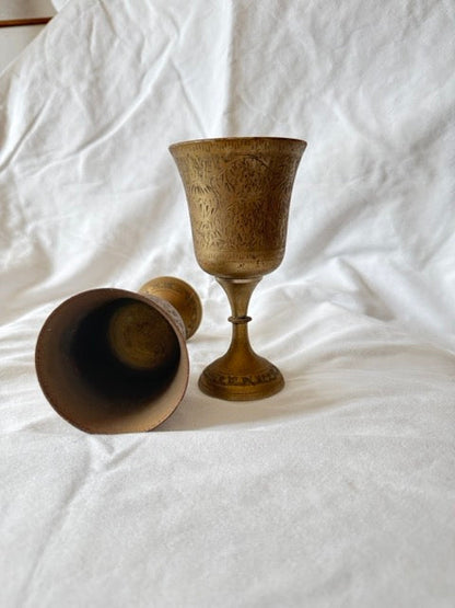 Brass goblets showing interior and profile