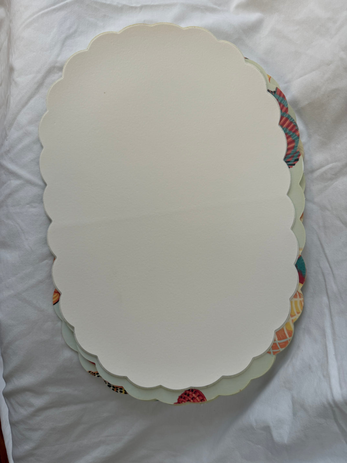 Cream backs of placemats, stacked