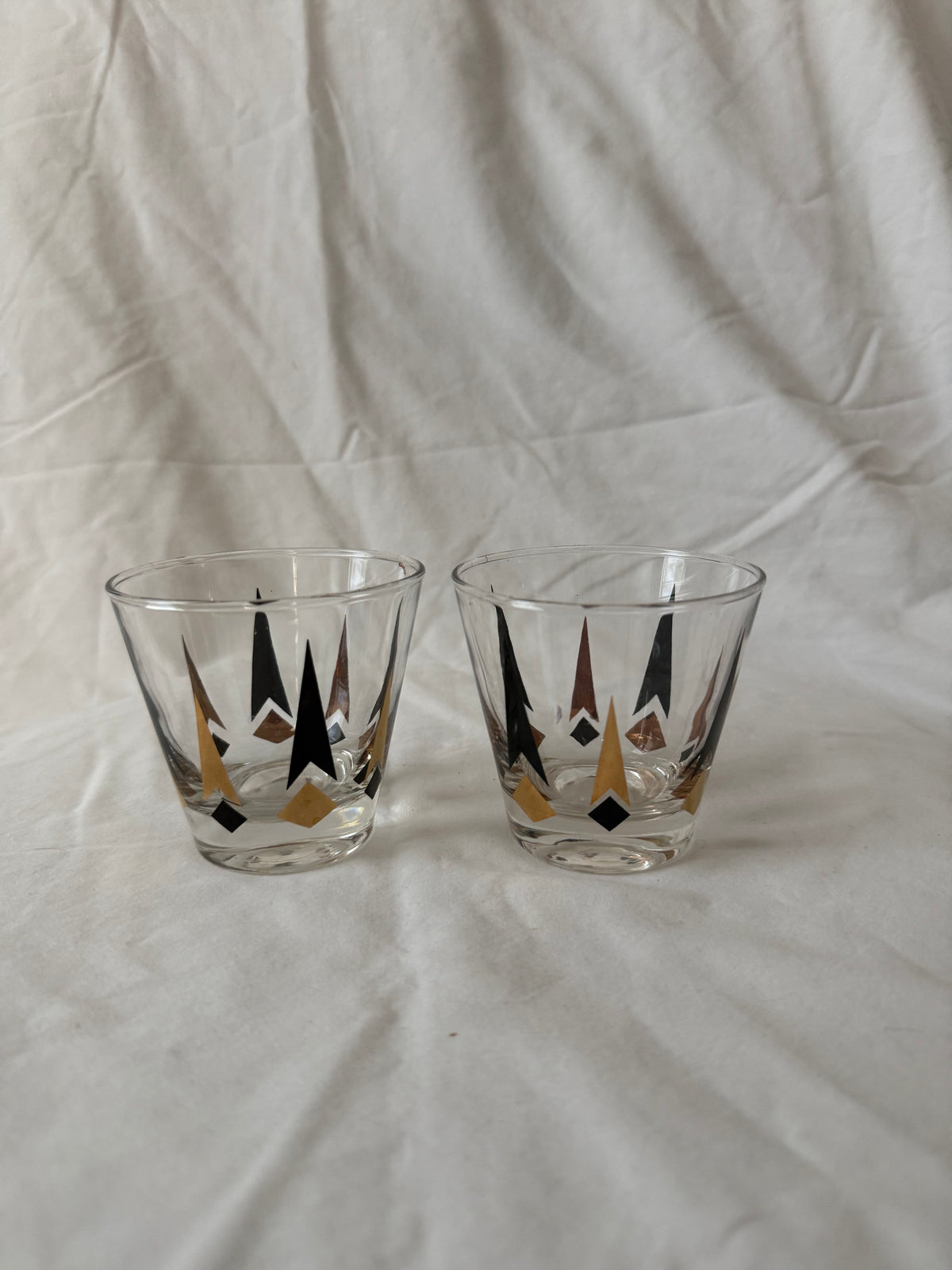 Pair of black and gold starburst rocks glasses