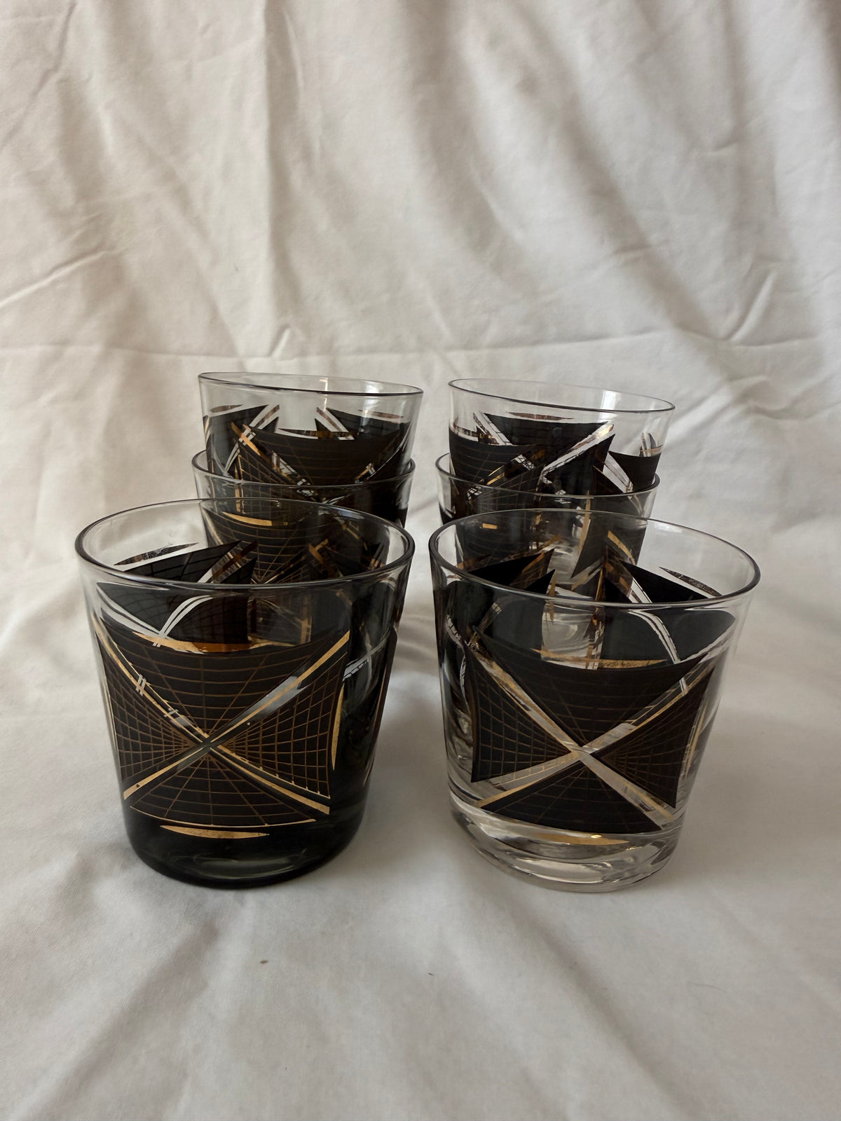 Set of six black and gold geometric lowball glasses