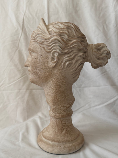 Goddess head, right profile with hair knot