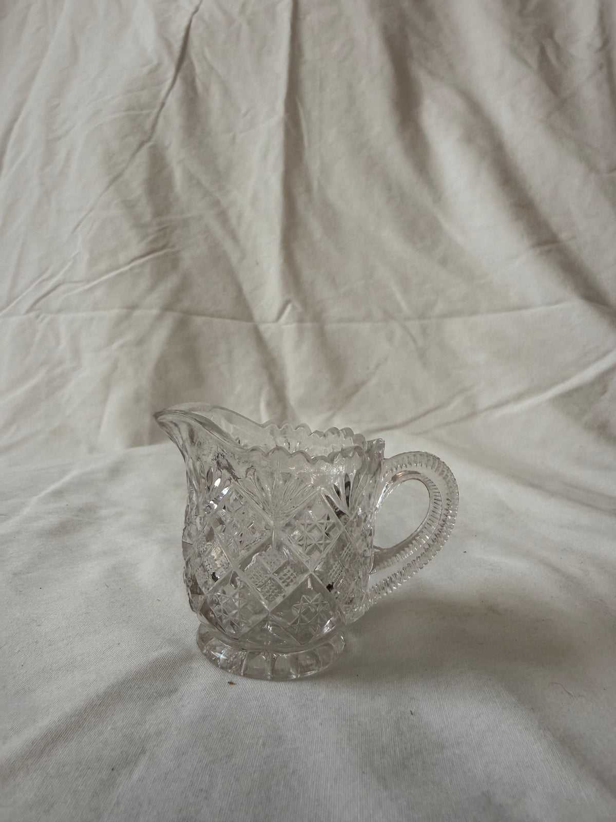 Pressed glass creamer