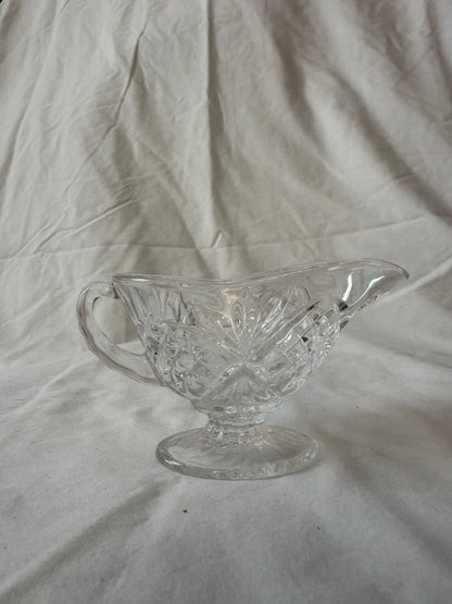 Pressed glass footed gravy boat
