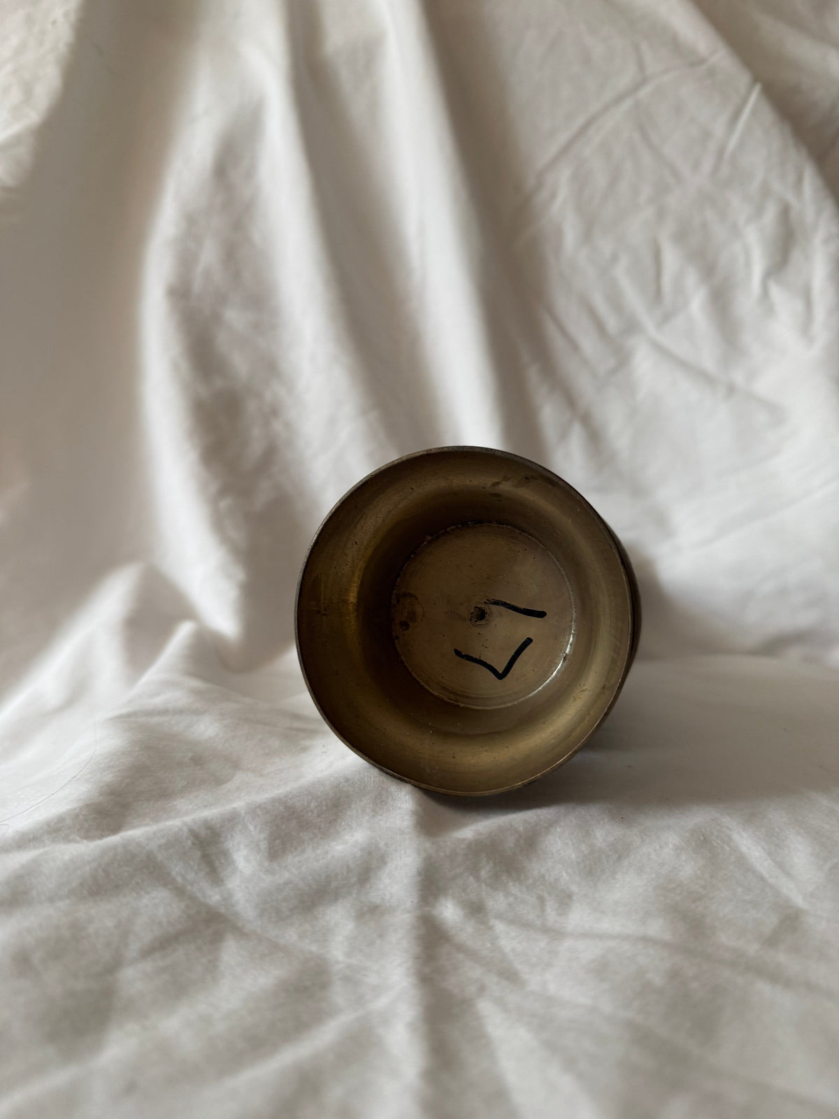 Underside of the brass vase, second view