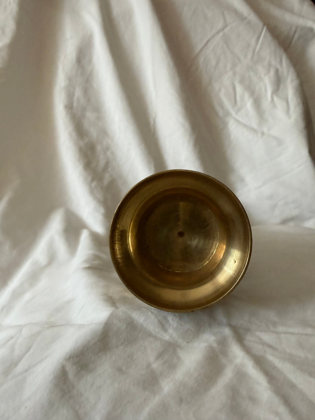 Underside of the etched brass vase