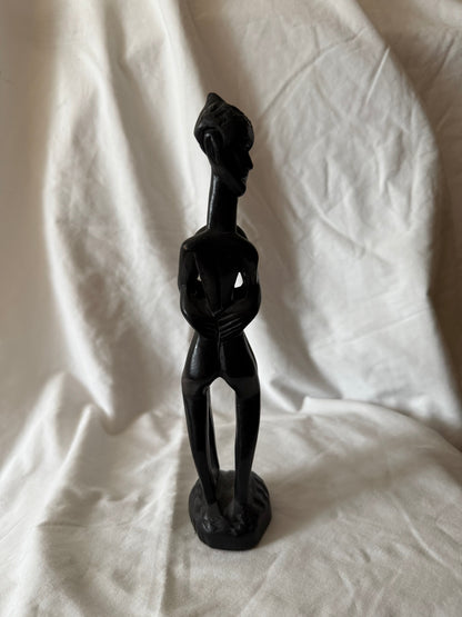 Side view of the carved wood figure