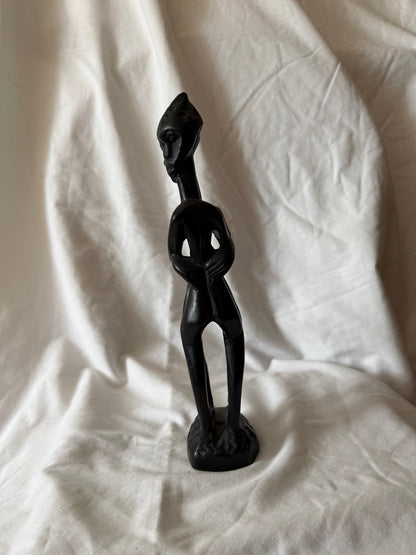 Other side view of the carved wood figure