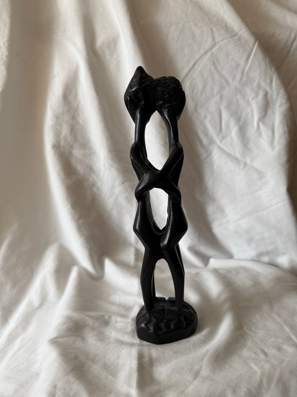 Angled view of the carved wood sculpture