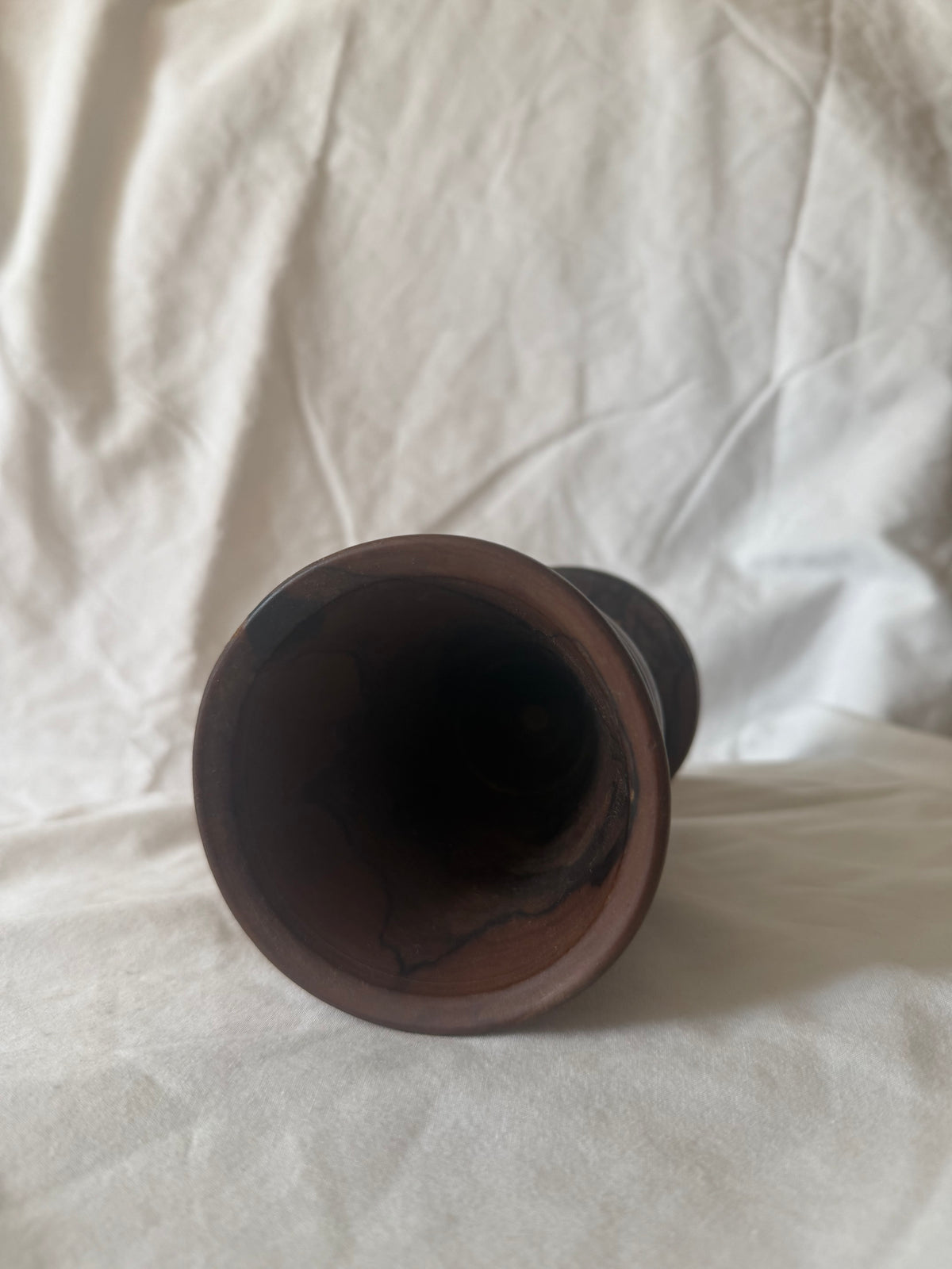 Interior of turned wood goblet vase