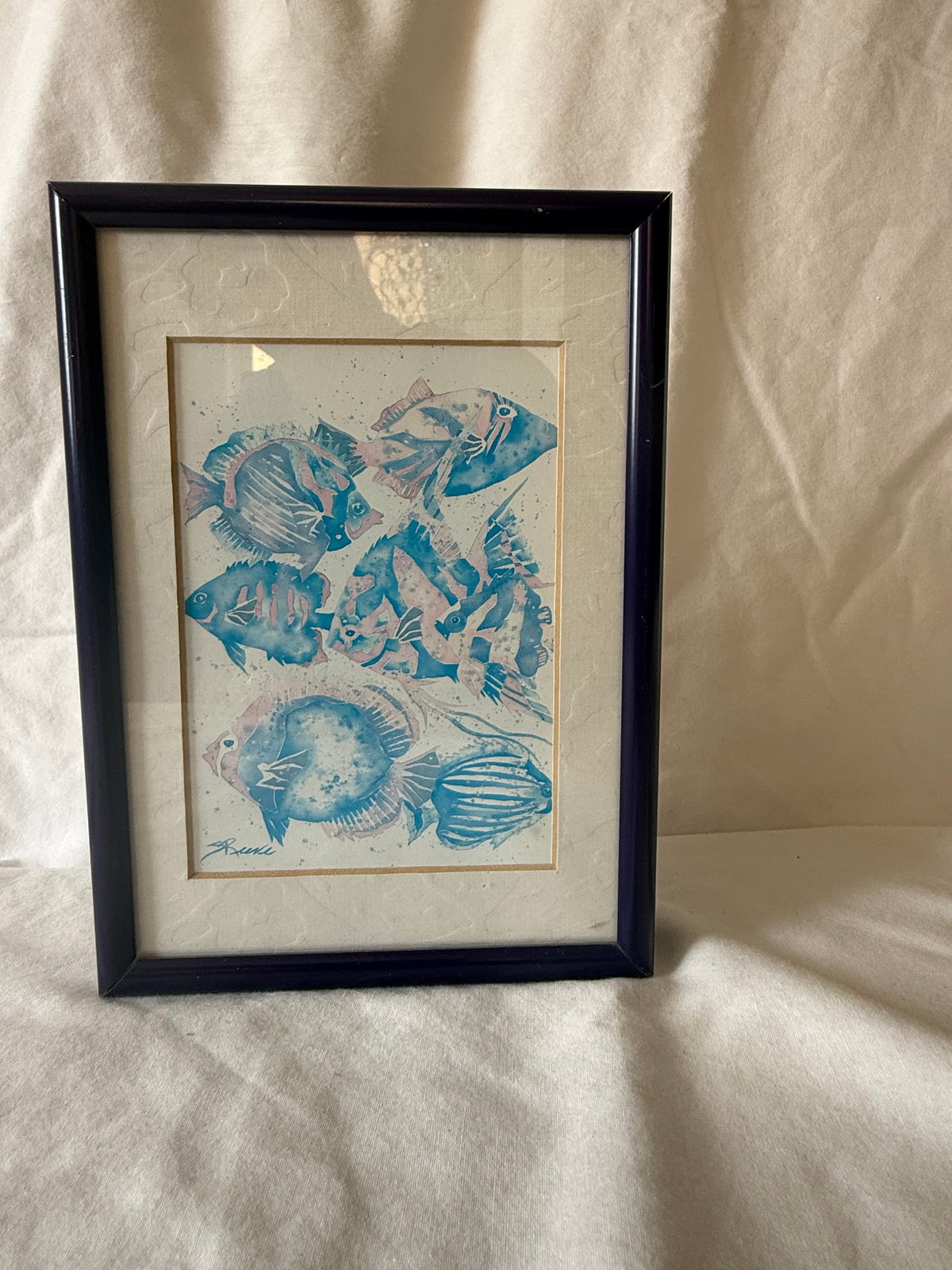 Framed fish print showing signature