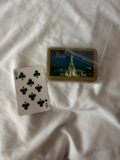 Paris playing cards with case open and a card face shown