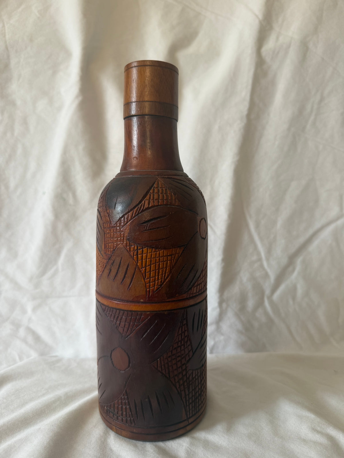 Hand-carved wood bottle with cap