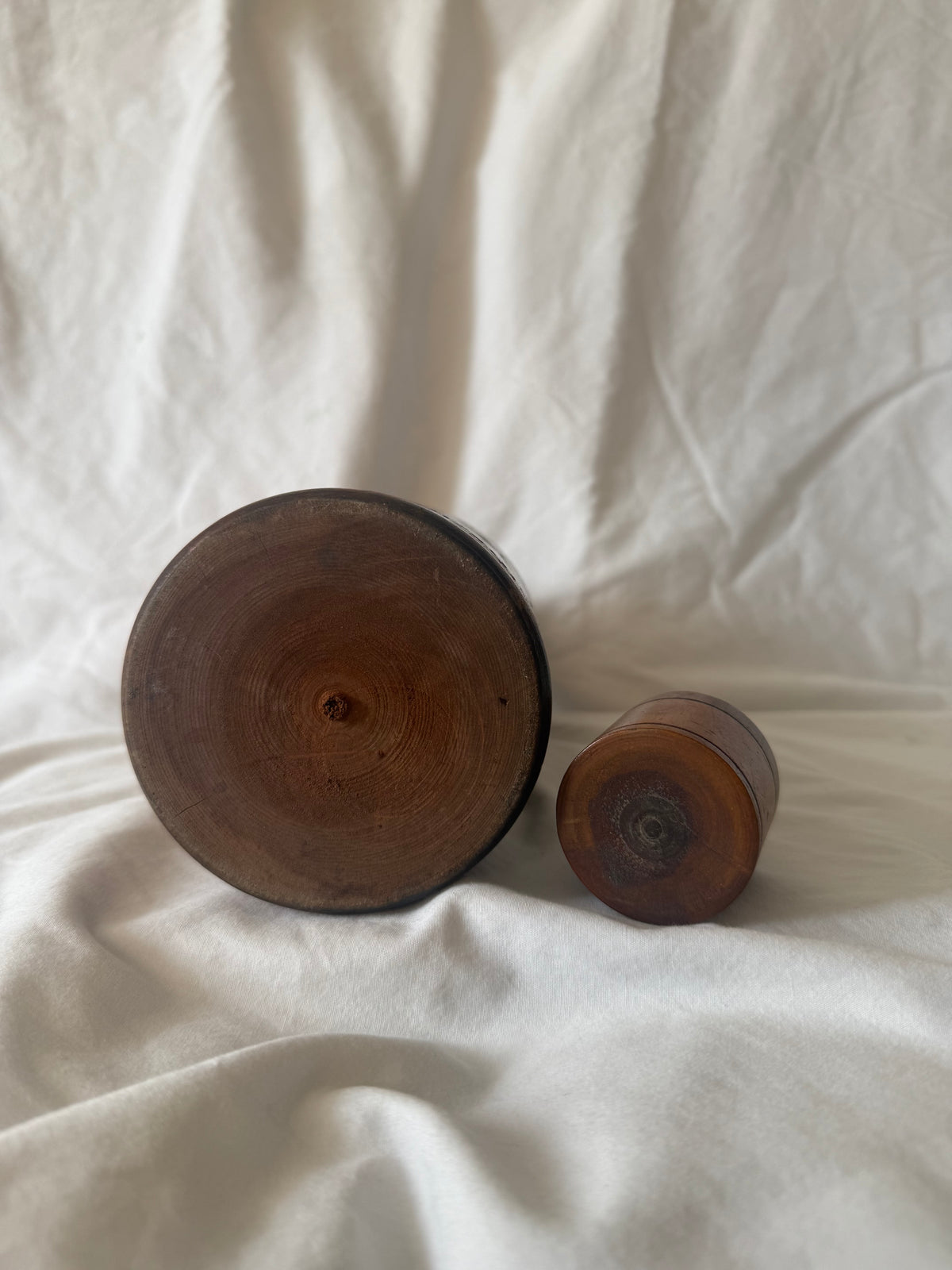 Base of carved wood bottle and cap