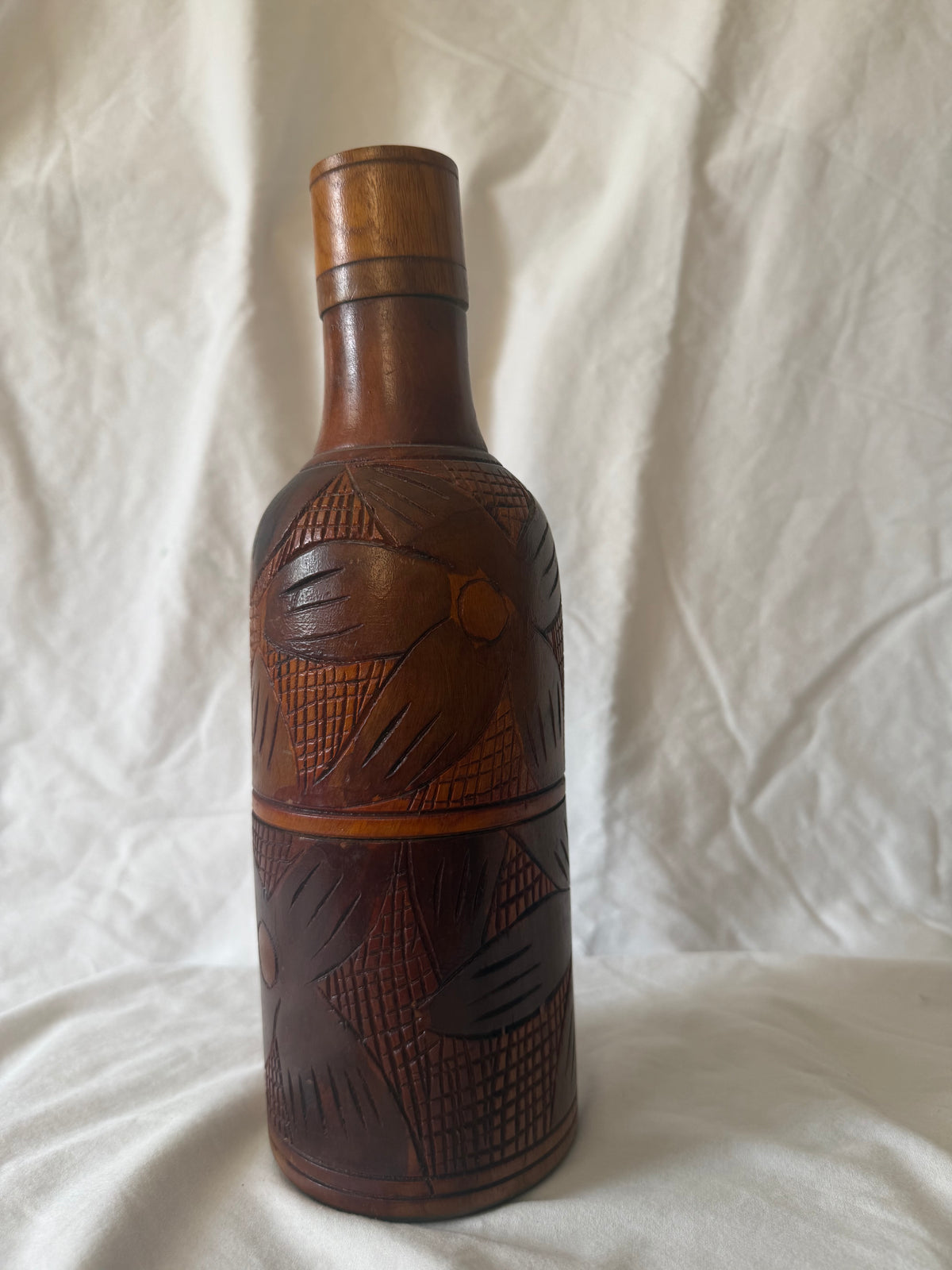 Hand-carved wood bottle, alternate side