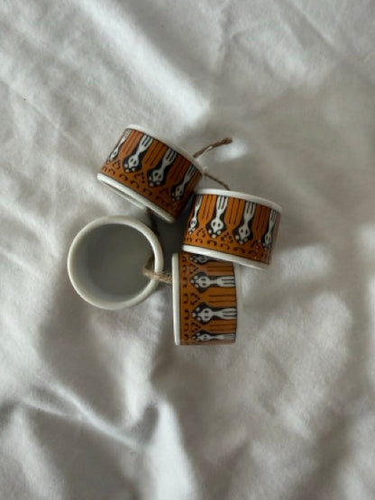 Four porcelain napkin rings from above