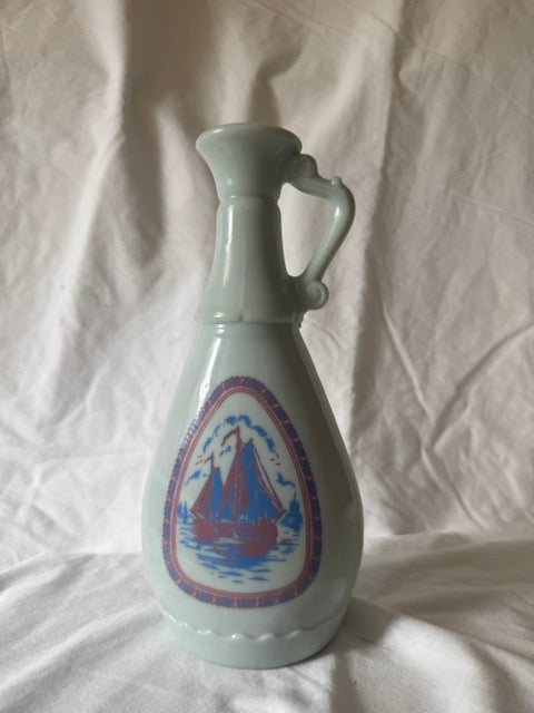 Jim Beam milk glass decanter with sailing ship medallion